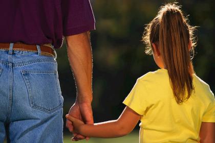 Father Holding Daughter's Hand